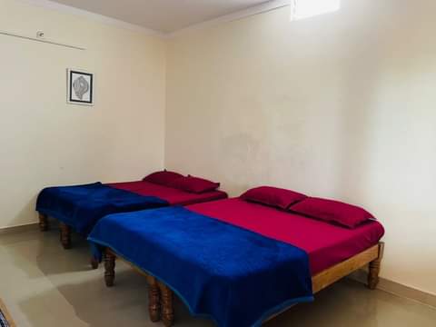 Comfortable rooms at Rakis Homestay in Mysore