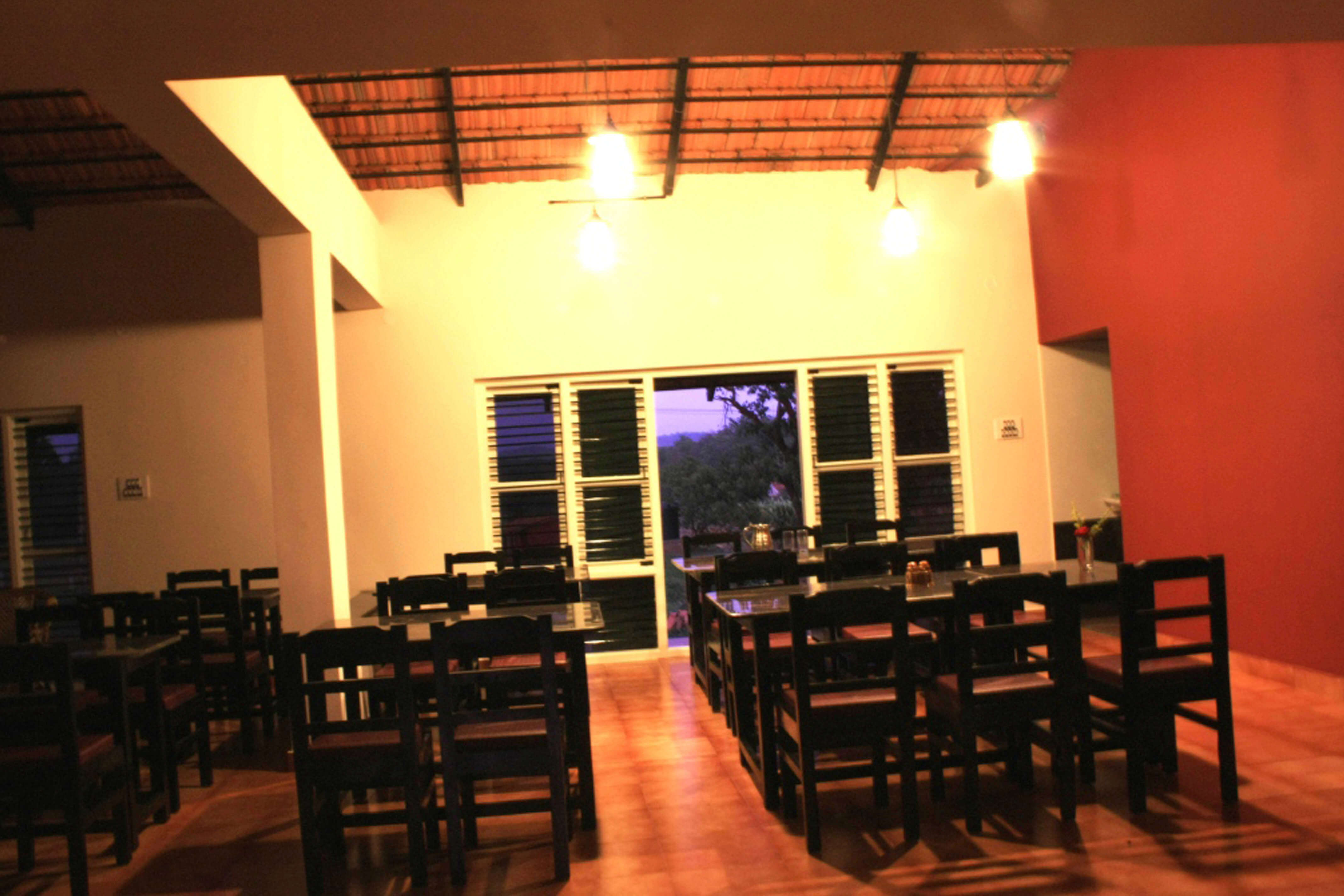 A family enjoying dinner at Dandeli homestay dining