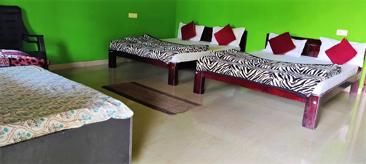 Cozy bedroom interior of budget homestay in Sakleshpur